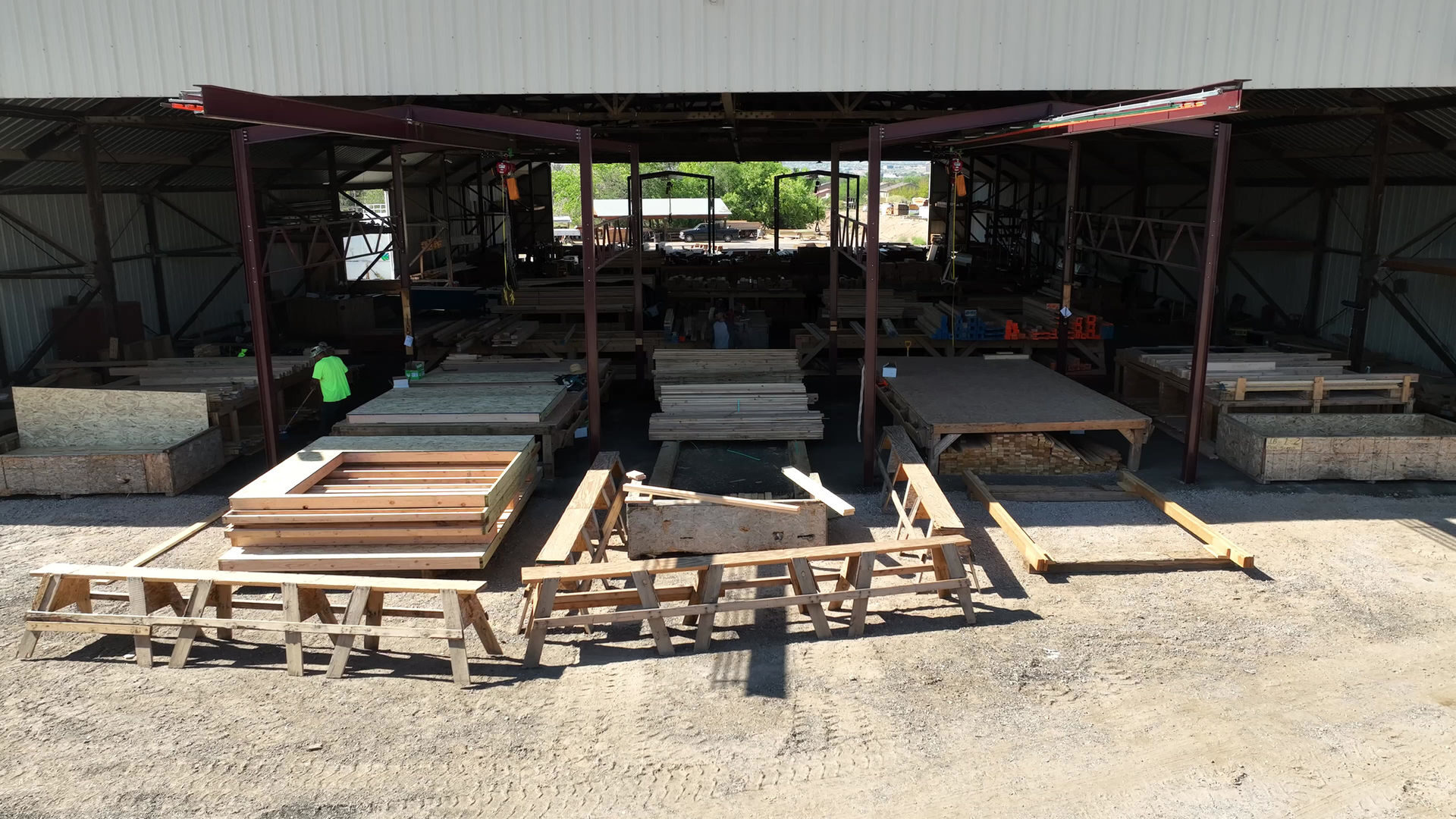 Wall panel assembly tables under the production bay